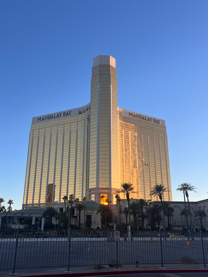 Mandalay Bay Resort in Las Vegas illuminated by the warm glow of sunset, reflecting elegance and luxury.